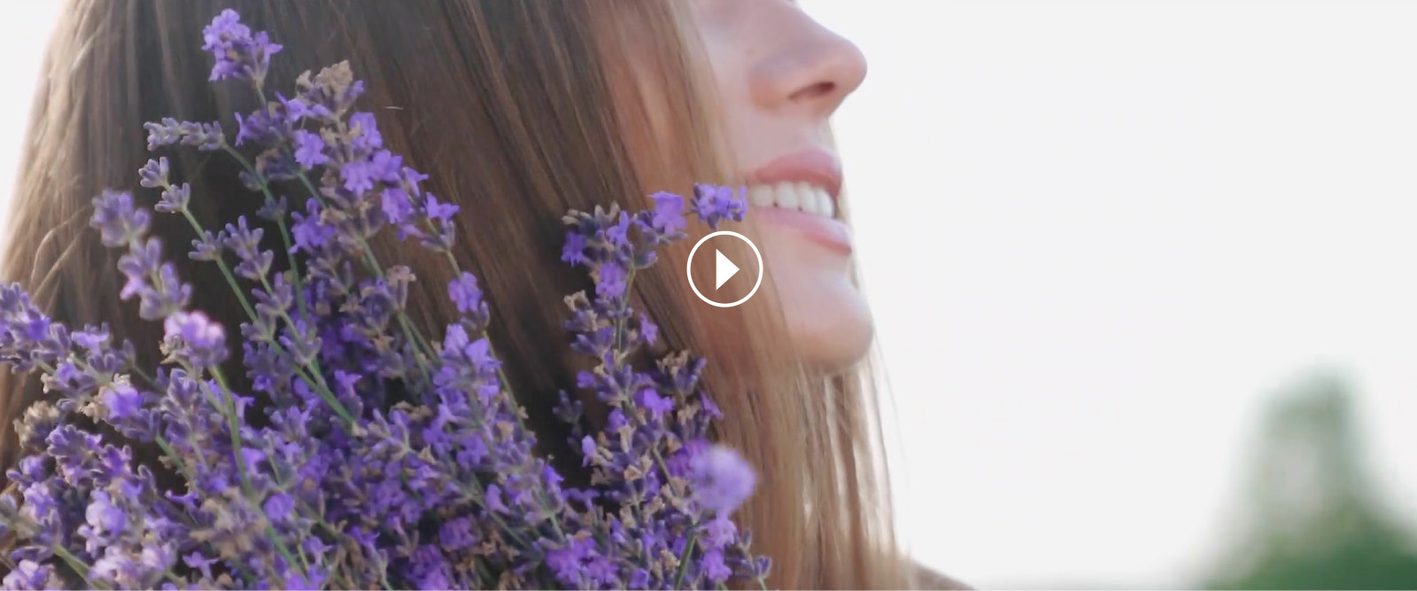 woman holding flowers, video play button