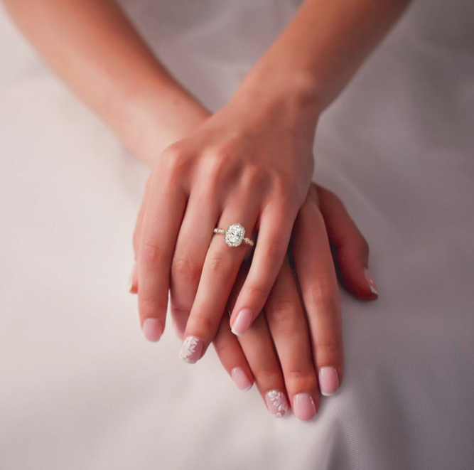 woman with ring and hands crossed